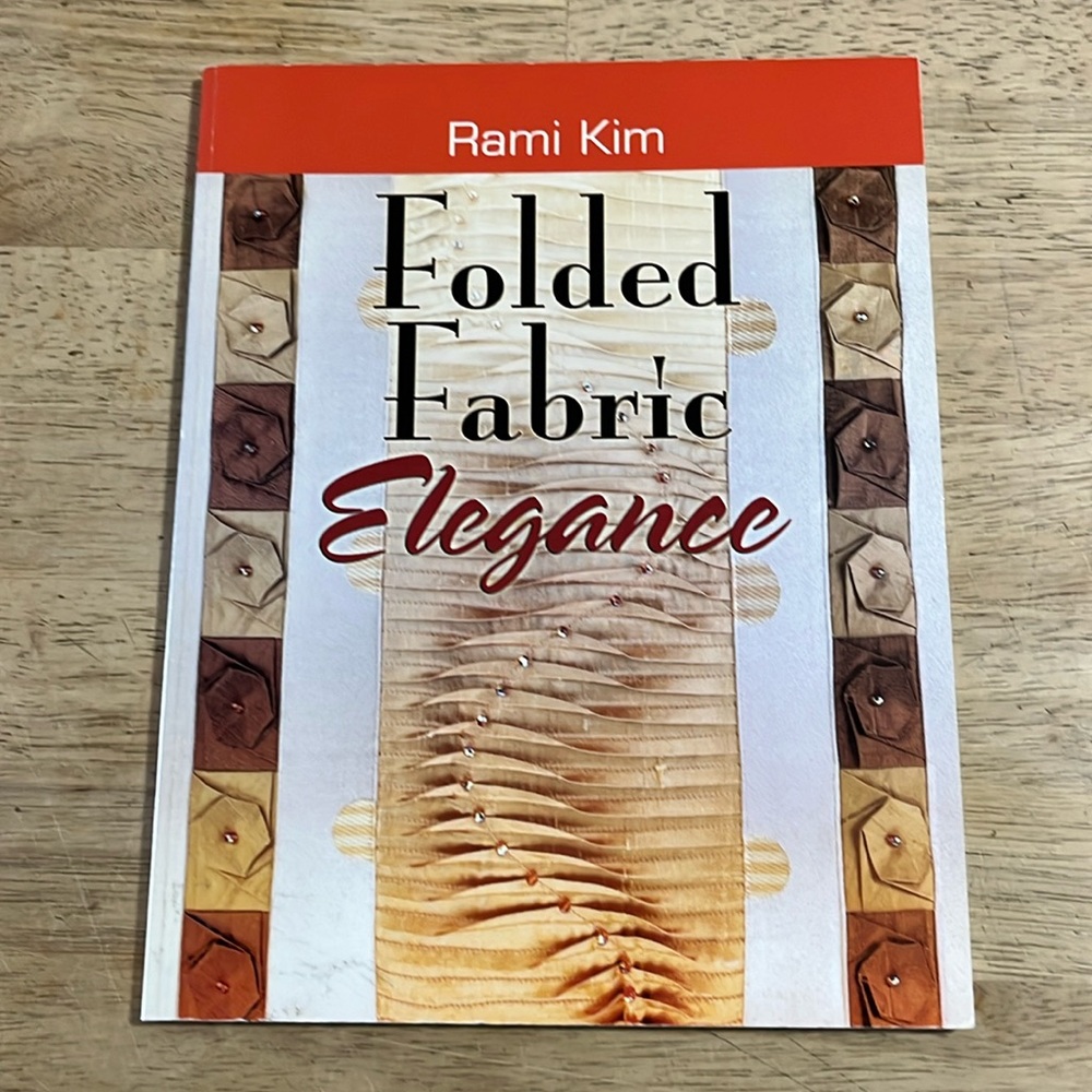 Folded Fabric Elegance by Rami Kim